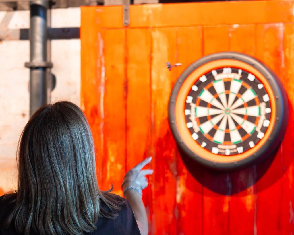 Girl playing darts games at Factory Floor Wigan